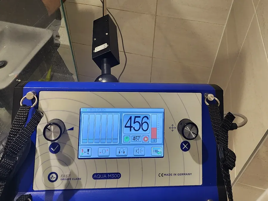 Specialist test instrument positioned at exposed shower controls in the Brighton ensuite