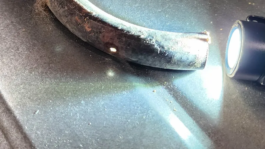 Damaged hot water pipework from leak detection investigation in Camberley