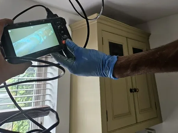 Endoscopic camera used to inspect a concealed leak detection area