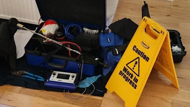 Leak detection equipment set up safely inside a customer property