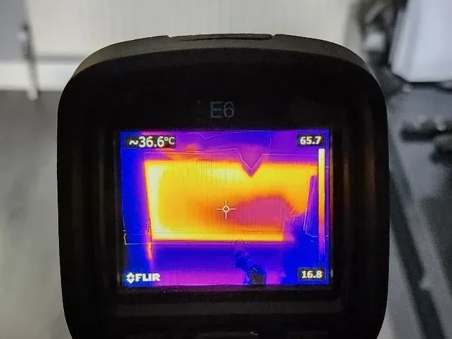 Thermal imaging camera used during central heating leak detection