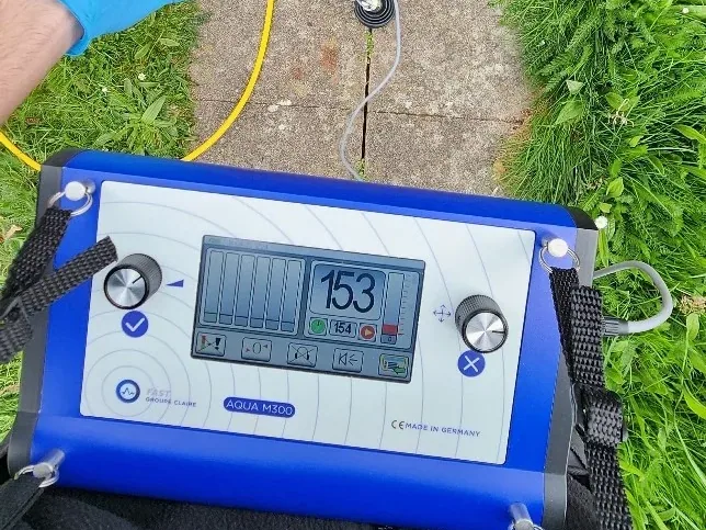 Tracer gas sniffer used to locate a hidden pipe leak