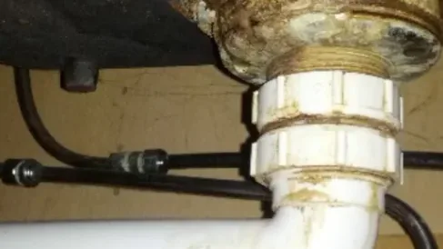Bathroom waste pipe area inspected during waste pipe leak detection